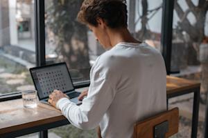 A person working remotely using a laptop.