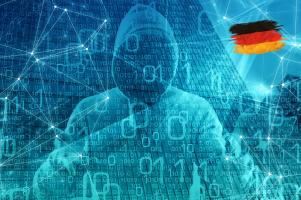 A cybercriminal in Germany in front of binary code and network connections.