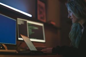A woman working on her computer.