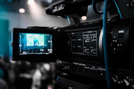 A camera recording footage in a studio.