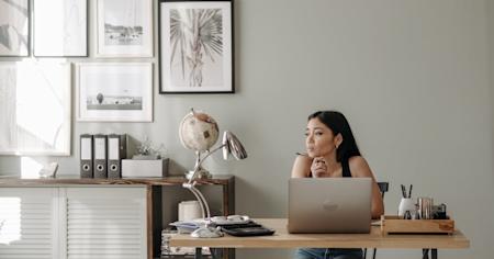 A person working remotely on their computer.