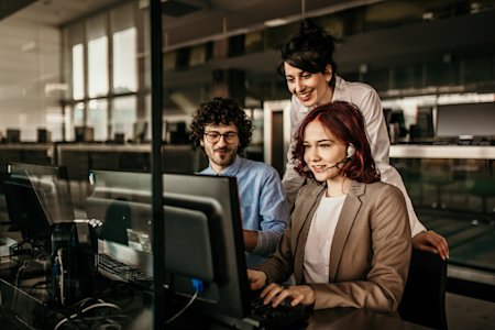 An IT support team attending a client remotely.
