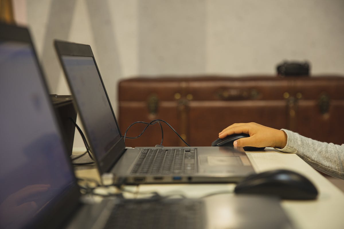 A person typing at their workstation.