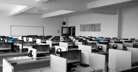 A room full of computers and office desks.