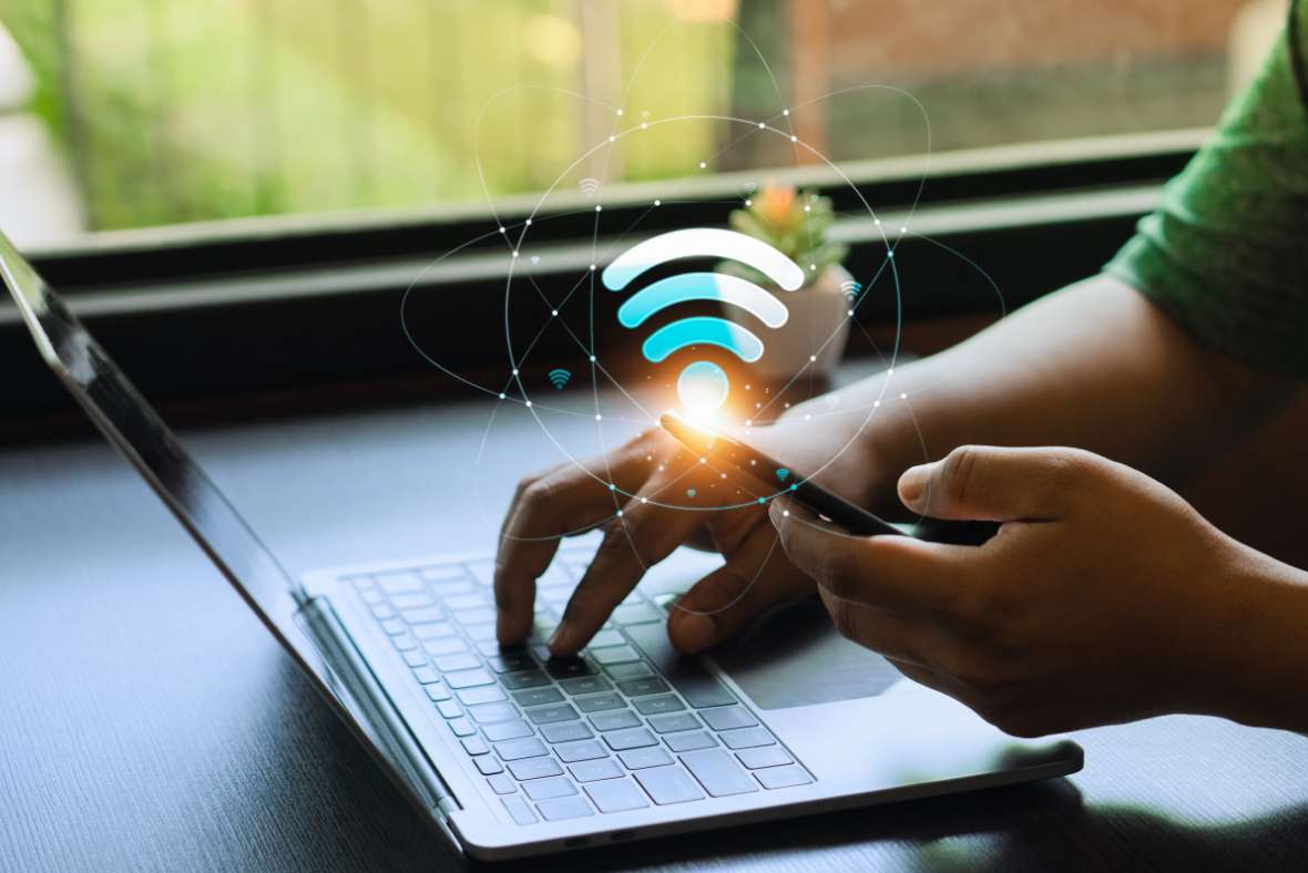 Laptop and phone accessing Wi-Fi network