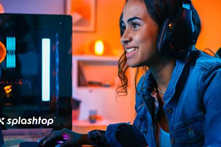 A woman using Splashtop to remotely access a desktop running Unreal Engine.