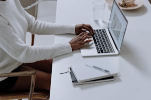 A person typing on a laptop.