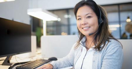 A smiling IT technician after providing remote support to a customer