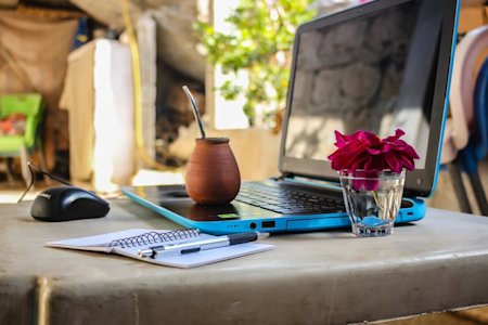 A remote worker's laptop in one of his travel destinations.