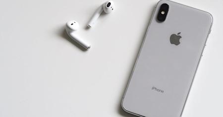 An iPhone and earbuds