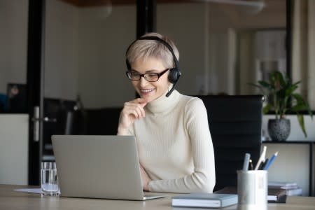 User on laptop evaluating Splashtop's remote access solutions