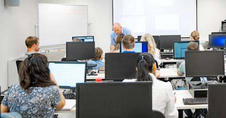 A school teacher using Splashtop Classroom to interact with his students.