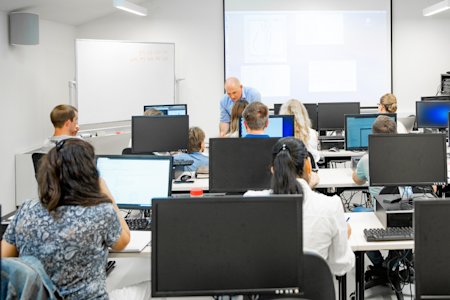 A school teacher using Splashtop Classroom to interact with his students.